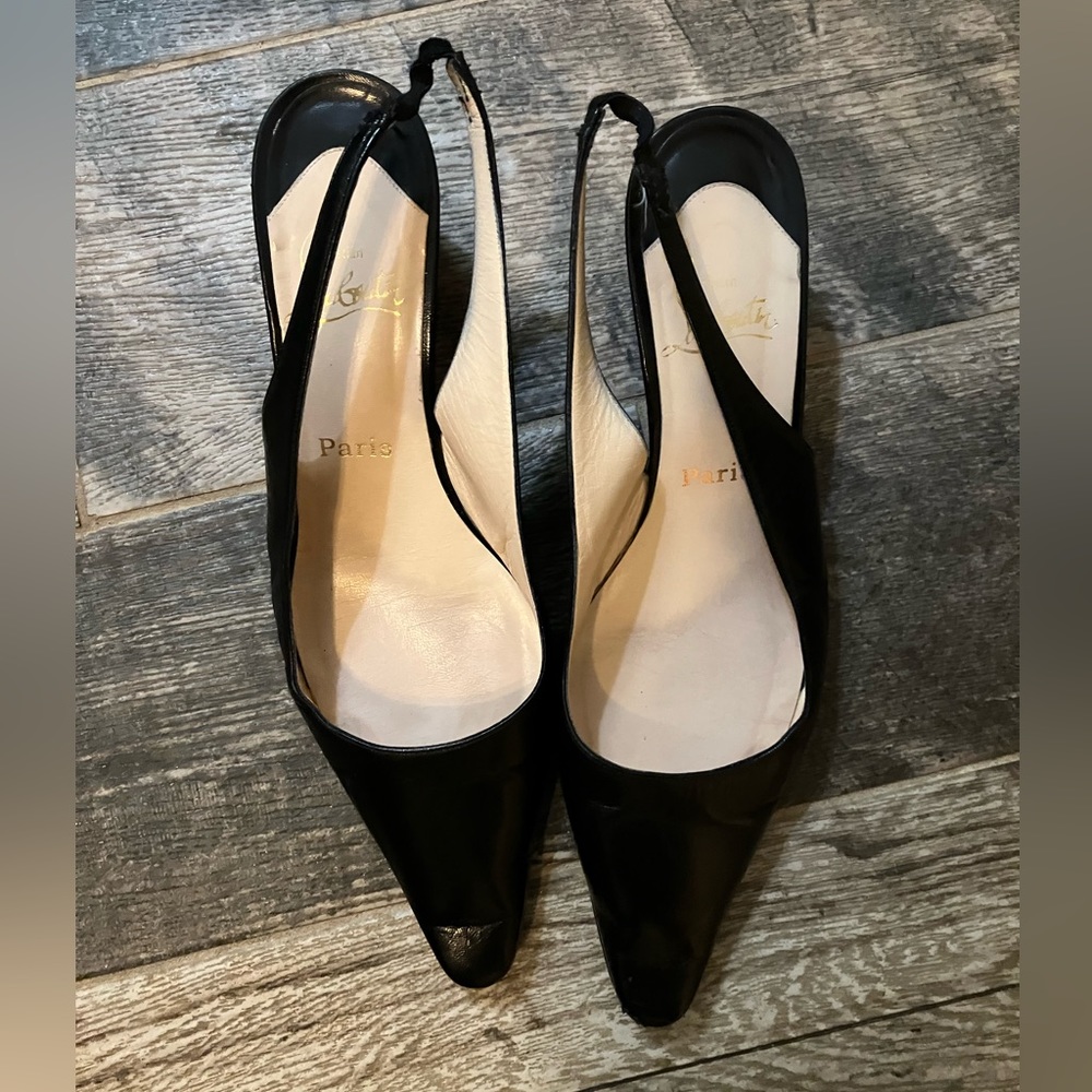 Black leather Christian Louboutin sling backs